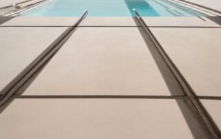 This image shows a pool deck that was repaiered. Flagstones were used.
